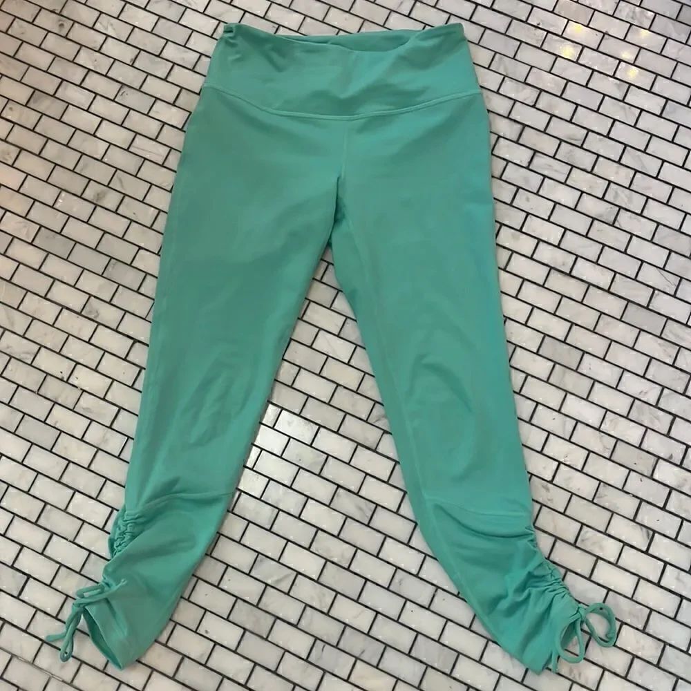 Zella green yoga pants with cinch ties at ankles. Have matching athletic bra